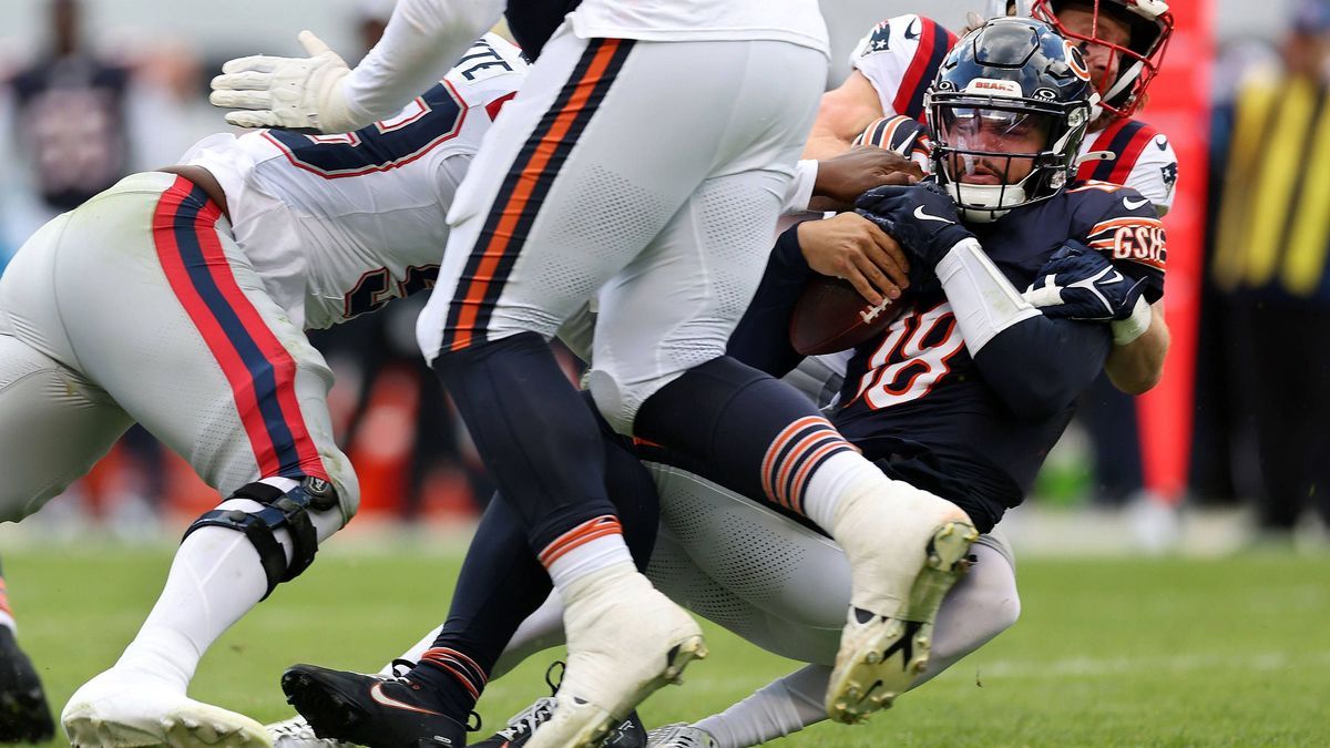 SPORTS-FBN-PATRIOTS-DEFENSE-TB Chicago Bears quarterback Caleb Williams (18) is sacked by New England Patriots defensive end Keion White (left) and safety Brenden Schooler (right) in the third quar...