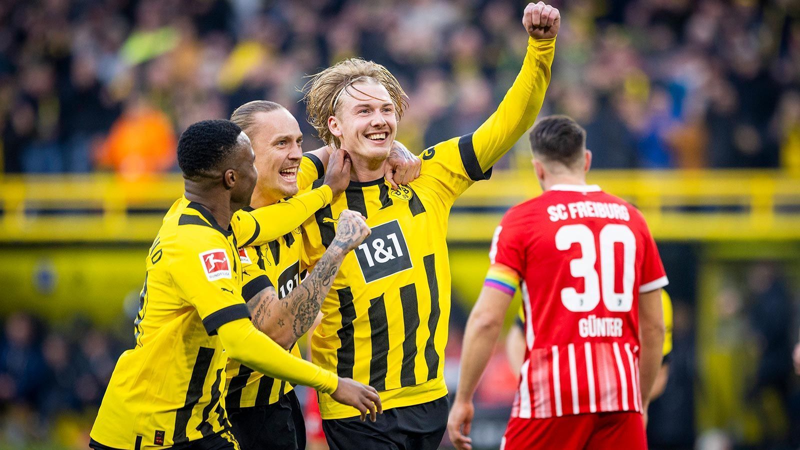 
                <strong>Gewinner: Julian Brandt (Borussia Dortmund)</strong><br>
                Bei dem Jubel über Sébastien Hallers erstes Tor für den BVB, ausgerechnet am Weltkrebstag, ging sein Traumtor zum 4:1 fast unter. War auf seiner rechten Seite sehr aktiv und sorgte immer wieder für Torgefahr. Brandt war ein entscheidender Faktor beim Sieg der Dortmunder gegen den SC Freiburg und spielt aktuell eine bärenstarke Rückrunde. Wenn er die Form hält, könnte er eine wichtige Rolle im Titelkampf einnehmen und auch wieder in der Nationalmannschaft ein Thema sein. 
              