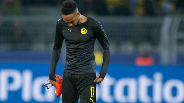 
                <strong>Pierre-Emerick Aubameyang: Fehltritte und Provokationen</strong><br>
                BVB-Coach Peter Bosz streicht Stürmerstar Pierre-Emerick Aubameyang für das Spiel beim VfB Stuttgart am Freitag "aus disziplinarischen Gründen" aus dem Kader. Was immer sich der Gabuner auch geleistet hat - es ist nicht sein erster Fauxpas in Dortmund. ran.de zeigt seine Fehltritte.
              