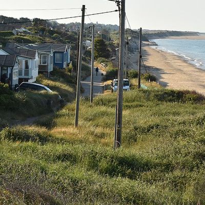 INSIGHT: Stay or go? Rising seas threaten to chase people from UK coasts