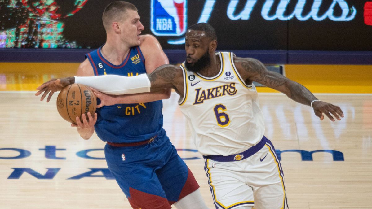 LeBron James 6 of the LA Lakers tries to steal the ball from Nikola Jokic 15 of the Denver Nuggets, during the Game 3 of the 2023 NBA Western Conference Finals - Los Angeles Lakers vs Denver Nugget...