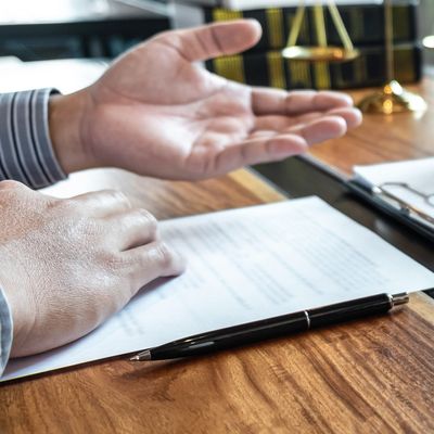 Male lawyer discussing negotiation legal case with client meeting with document contact in courtroom, law and justice concept