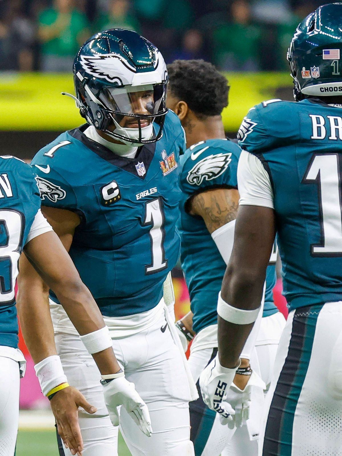 Philadelphia Eagles quarterback Jalen Hurts (1) and wide receiver A.J. Brown (11) celebrate a touchdown catch by Brown against the Kansas City Chiefs during the third quarter of Super Bowl LIX at C...
