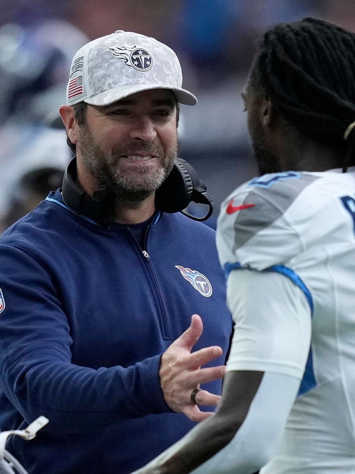 Tennessee Titans head coach Brian Callahan celebrates with wide receiver Calvin Ridley (0) after a scoring drive during the second quarter against the Houston Texans at NRG Stadium in Houston, Texa...