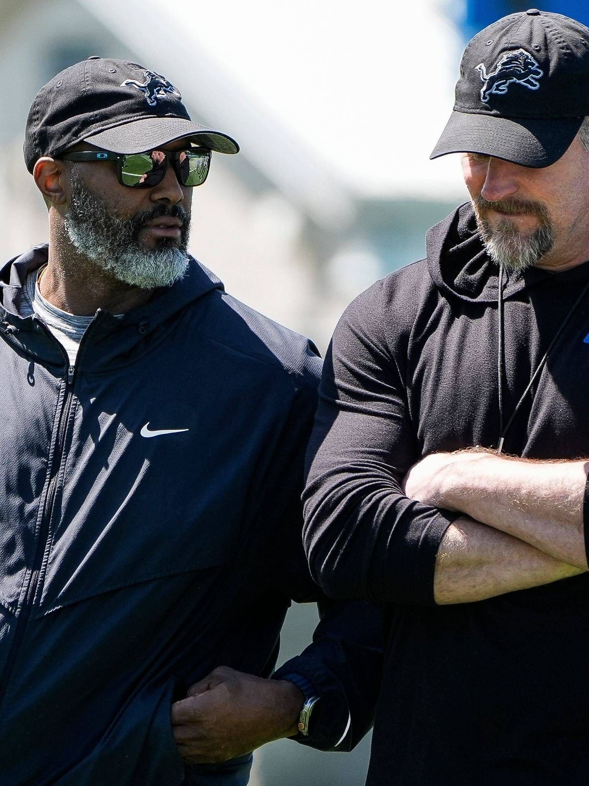 Syndication: Detroit Free Press Detroit Lions general manager Brad Holmes, left, talks to head coach Dan Campbell as they walk off the field after practice during rookie mini camp at Meijer Perform...