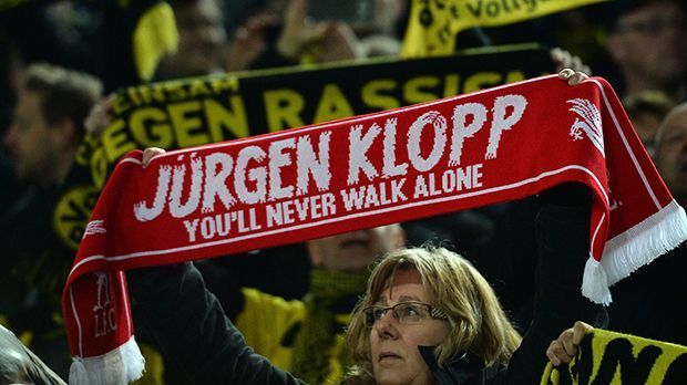 
                <strong>BVB-Fan mit Klopp-Schal</strong><br>
                Auch ein direktes Duell gegen seinen neuen Klub ändert nichts an der Verbundenheit der BVB-Fans mit Jürgen Klopp.
              
