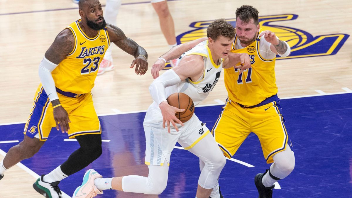 February 10, 2025, Los Angeles, California, United States: Utah Jazz s Lauri Markkanen (C) is defended by Los Angeles Lakers Luka Doncic 77 and LeBron James 23 during an NBA, Basketball Herren, USA...