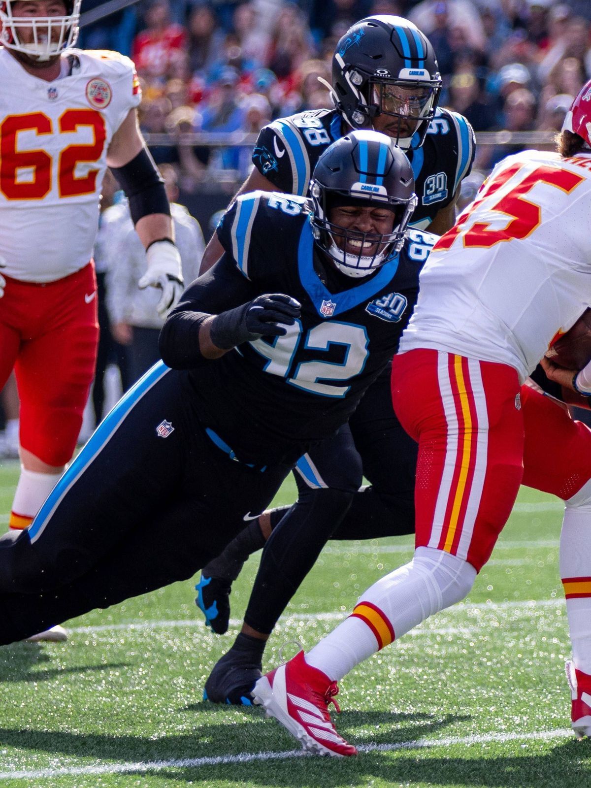 November 24, 2024: Carolina Panthers defensive end Jonathan Harris (92) sacks Kansas City Chiefs quarterback Patrick Mahomes (15) during the second quarter of the NFL, American Football Herren, USA...