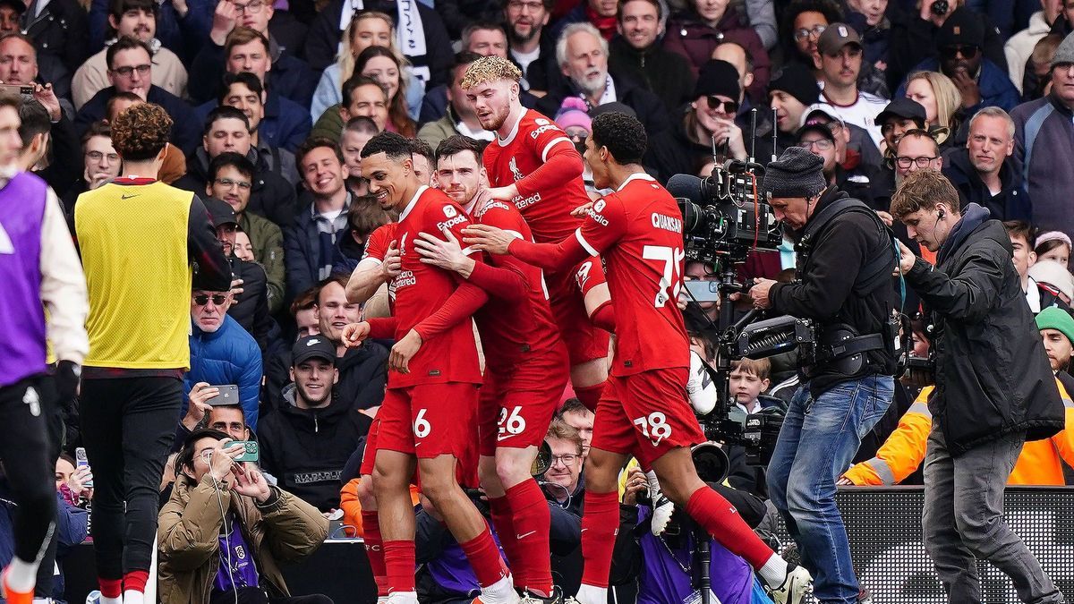 Fulham v Liverpool - Premier League - Craven Cottage Liverpool s Trent Alexander-Arnold (left) celebrates with team-mates after scoring their side’s first goal during the Premier League match at Cr...