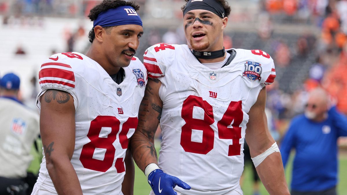 CLEVELAND, OH - SEPTEMBER 22: New York Giants tight end Jakob Johnson (89) and New York Giants tight end Theo Johnson (84) leave the field following the following the National Football League game ...