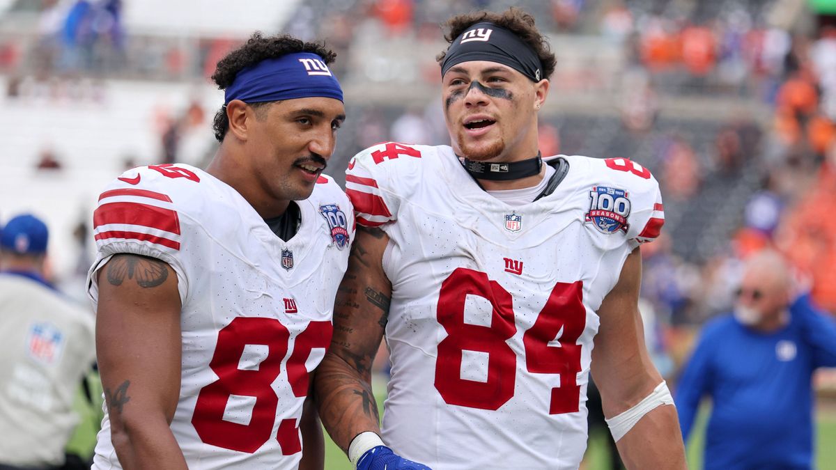 CLEVELAND, OH - SEPTEMBER 22: New York Giants tight end Jakob Johnson (89) and New York Giants tight end Theo Johnson (84) leave the field following the following the National Football League game ...