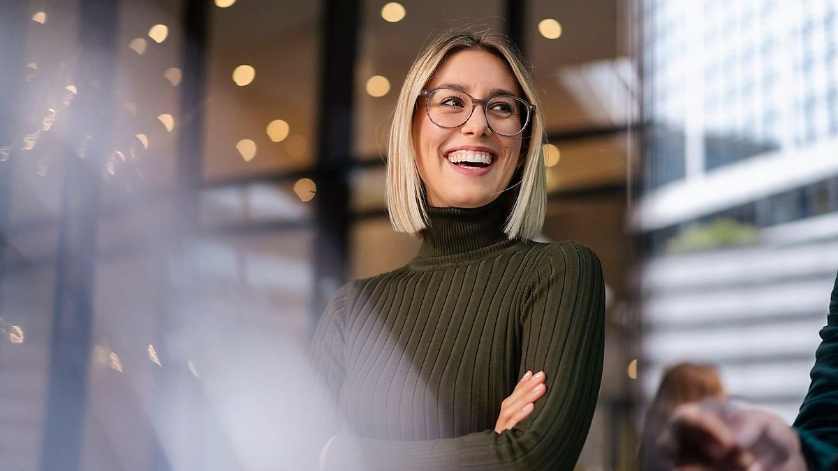 Portrait of happy young woman in the city