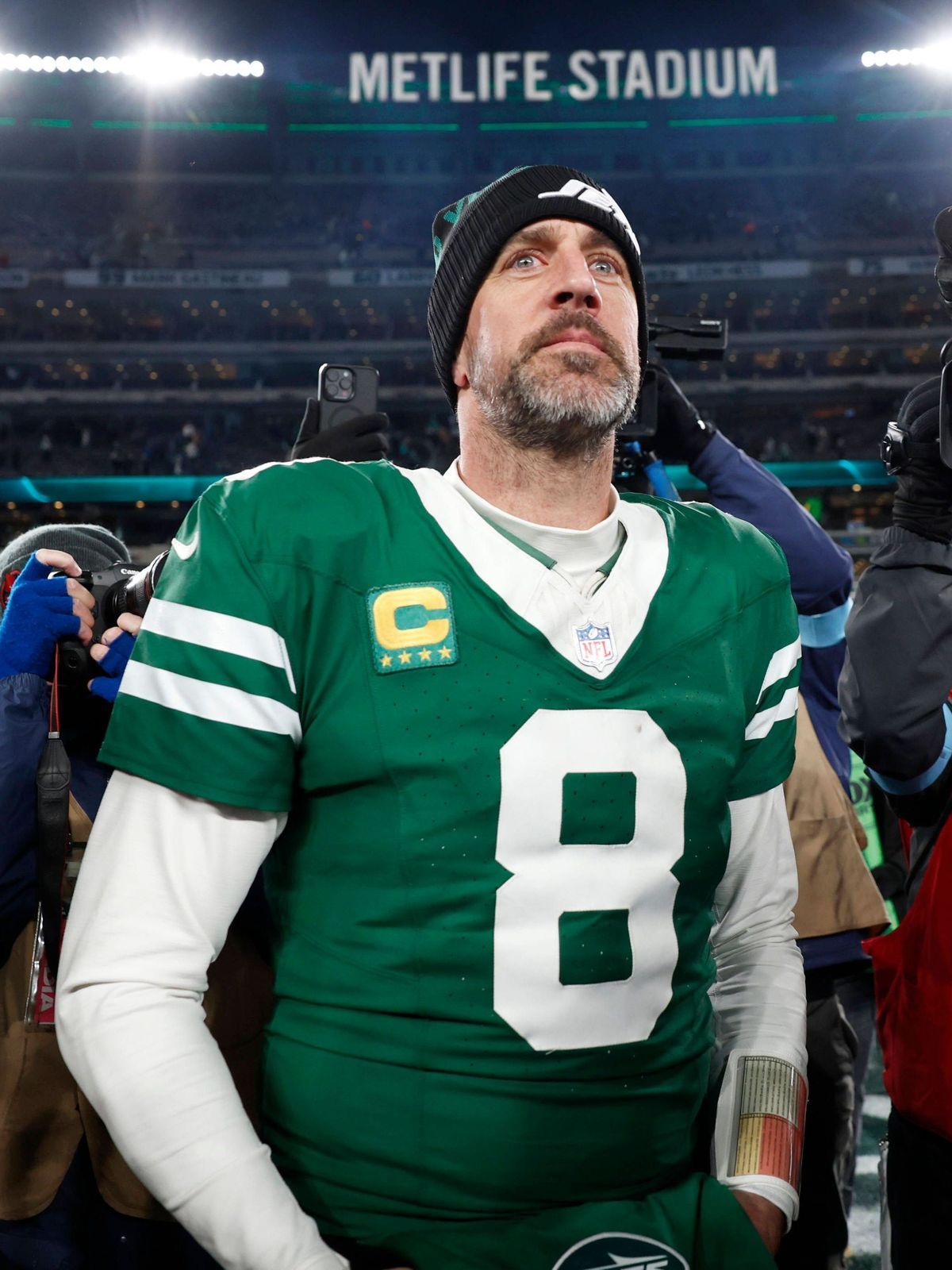 New York Jets quarterback Aaron Rodgers walks on the field after the game against the Miami Dolphins where he threw his 500th touchdown pass in his 20-year career in the final week of the NFL, Amer...