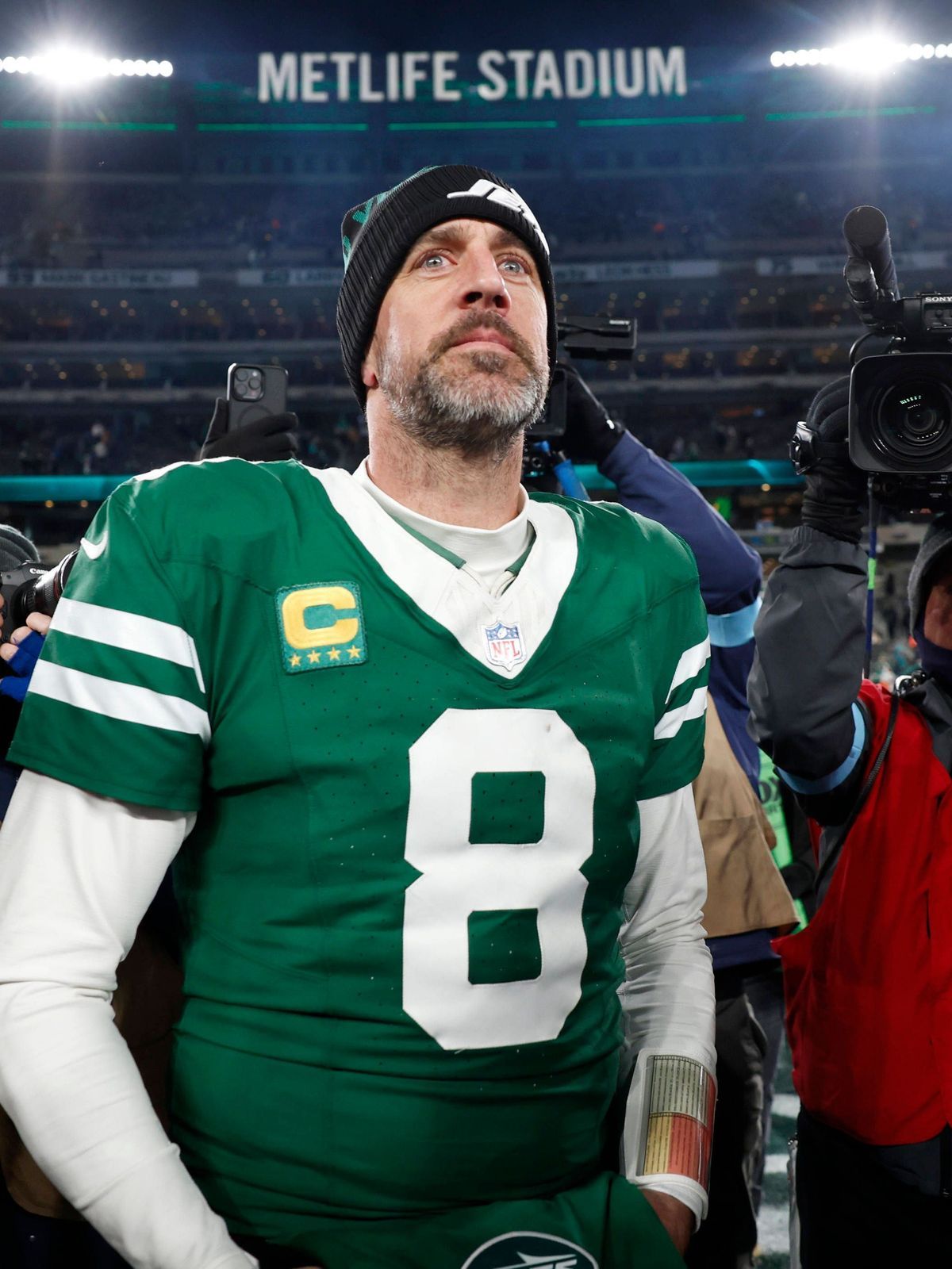 New York Jets quarterback Aaron Rodgers walks on the field after the game against the Miami Dolphins where he threw his 500th touchdown pass in his 20-year career in the final week of the NFL, Amer...