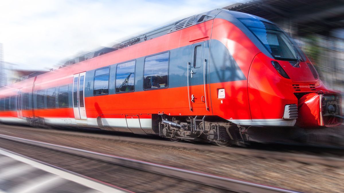 a german train passes a train station