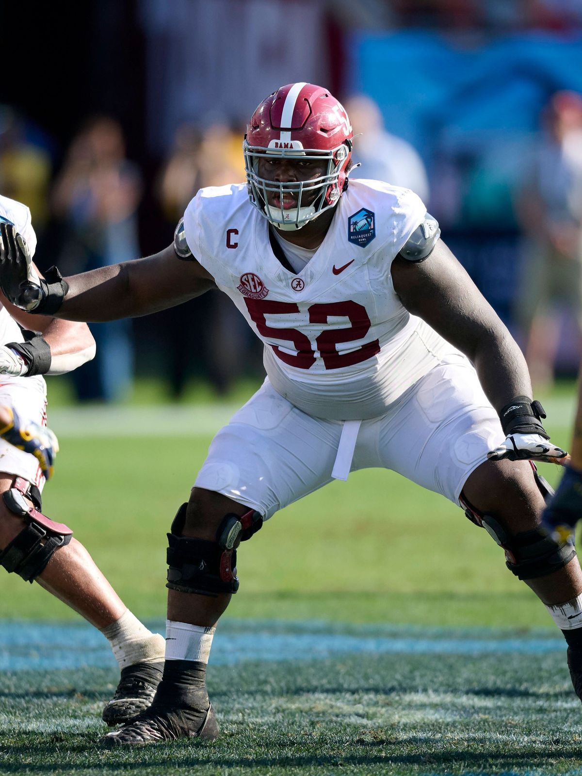 December 31, 2024: Alabama offensive lineman Tyler Booker (52) blocking during an NCAA, College League, USA football game between the Michigan Wolverines and Alabama Crimson Tide at Raymond James S...