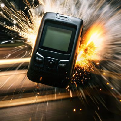 A cell phone is on fire and is being blown away by a blast of fire pager