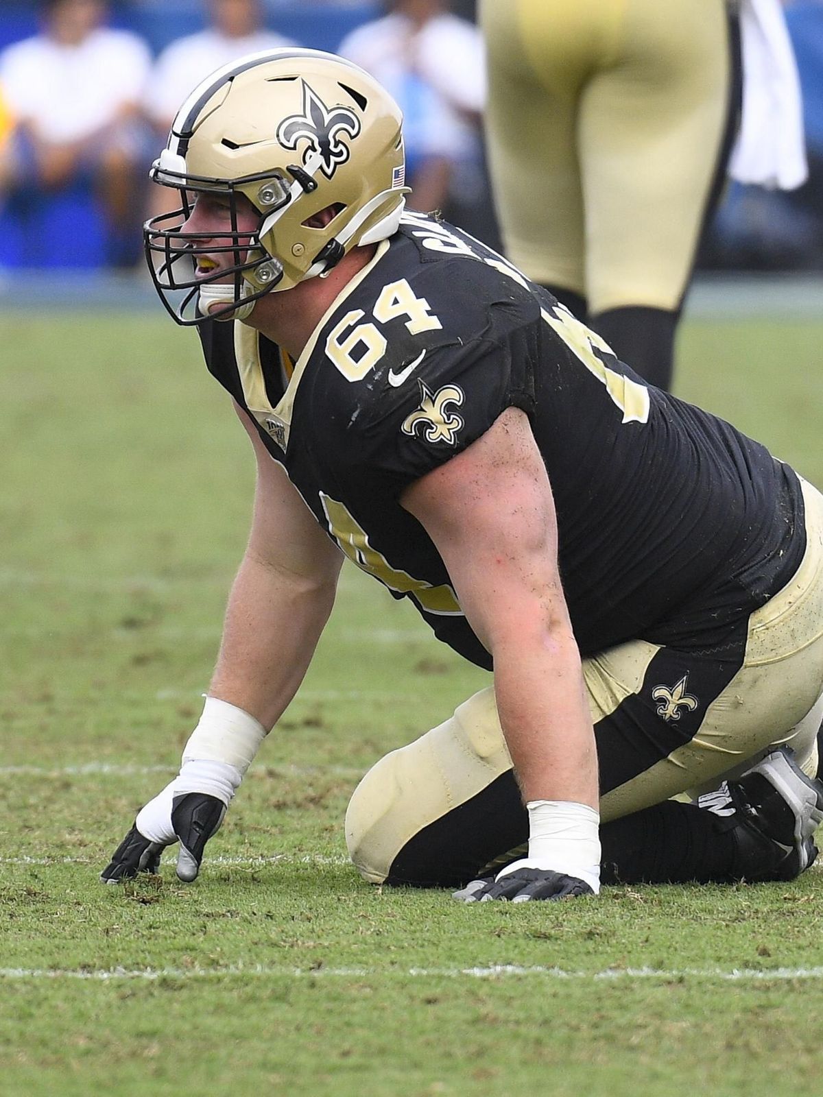 LOS ANGELES, CA - SEPTEMBER 15: New Orleans Saints Center Will Clapp (64) lays on the field as a flag is thrown in his direction for holding during an NFL, American Football Herren, USA game betwee...