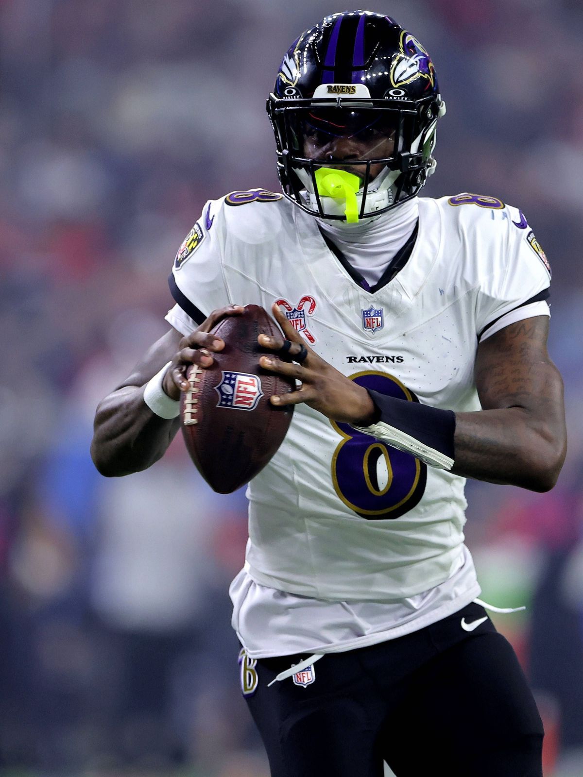 December 25, 2024, Houston, Texas, U.S: Baltimore Ravens quarterback Lamar Jackson (8) looks to pass downfield during the third quarter between the Houston Texans and the Baltimore Ravens at NRG St...