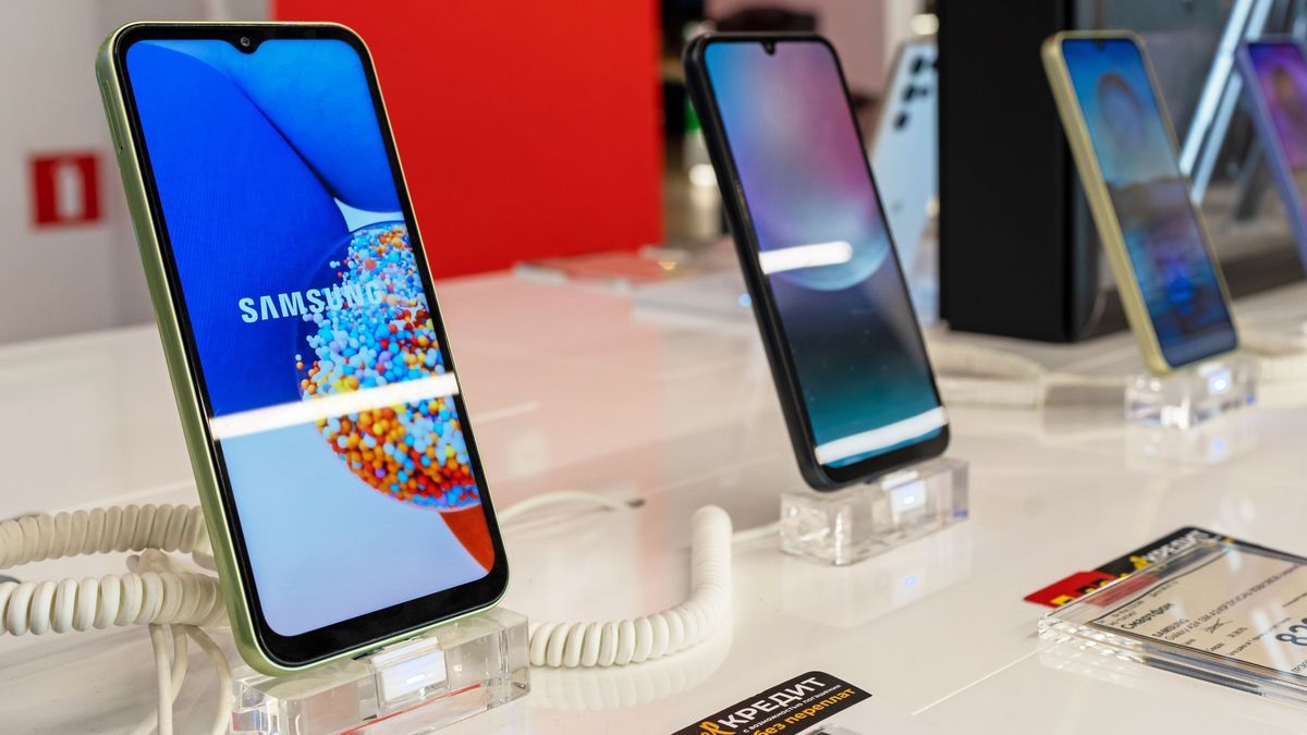 Samsung Galaxy Smartphones are shown on display in electronics store. Brand logo on the smartphone screen. Minsk, Belarus - november 28, 2023