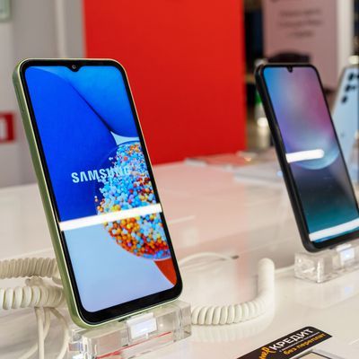Samsung Galaxy Smartphones are shown on display in electronics store. Brand logo on the smartphone screen. Minsk, Belarus - november 28, 2023