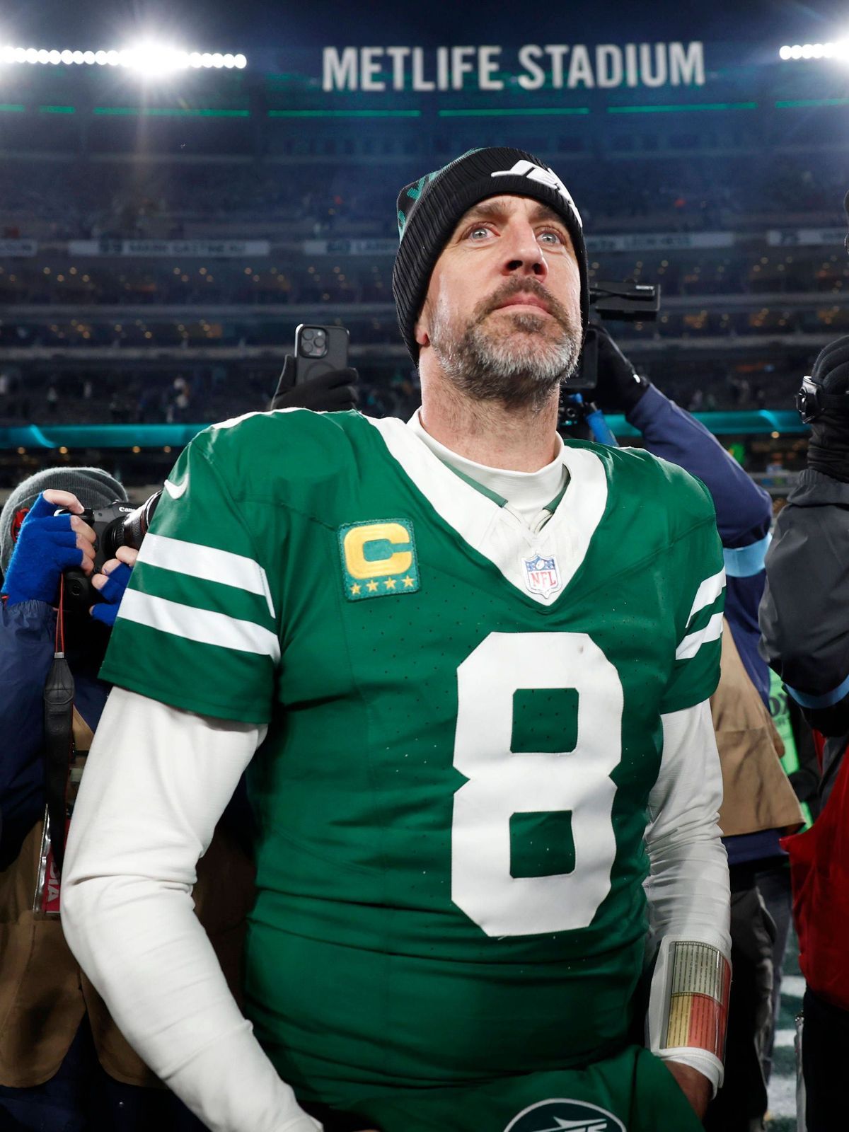 New York Jets quarterback Aaron Rodgers walks on the field after the game against the Miami Dolphins where he threw his 500th touchdown pass in his 20-year career in the final week of the NFL, Amer...