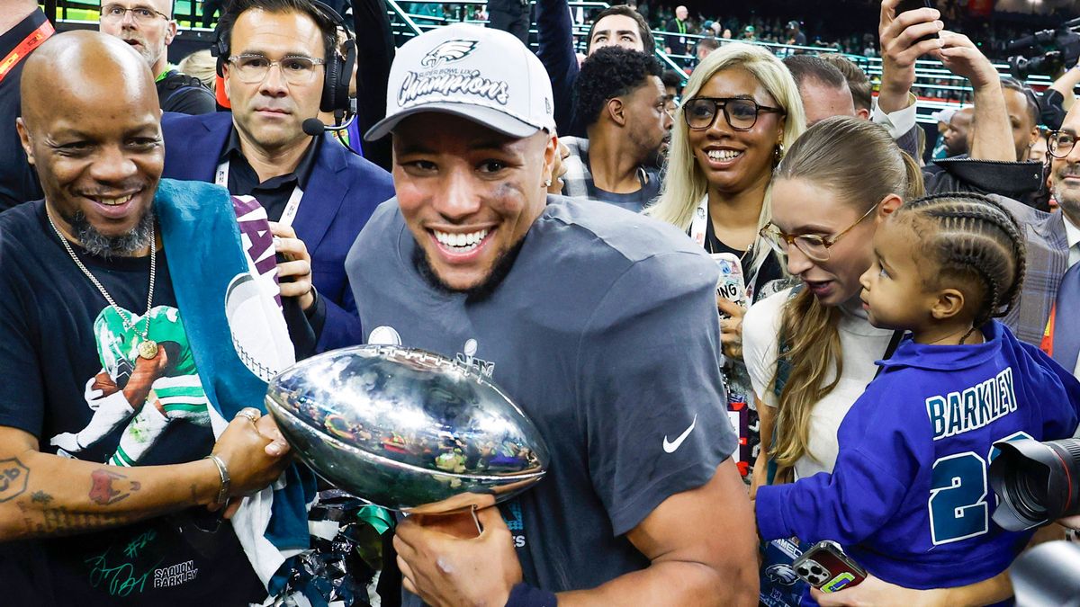 Philadelphia Eagles running back Saquon Barkley (26) holds the Vince Lombardi Trophy during celebrations after the Eagles defeated the Chiefs 40-22 in Super Bowl LIX at Caesars Superdome in New Orl...