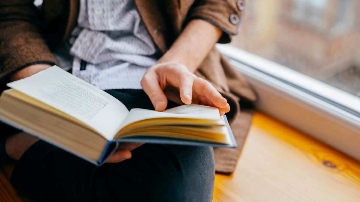 Young man reading a book