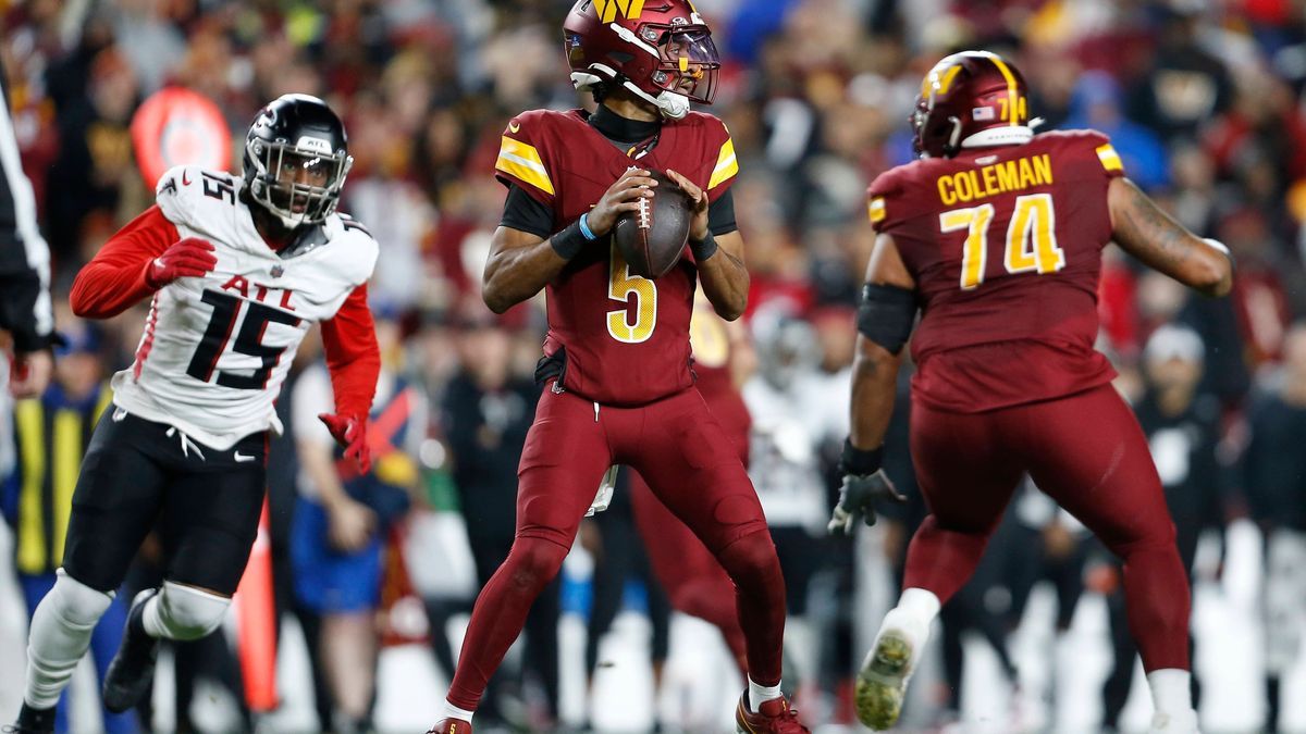 LANDOVER, MD - DECEMBER 29: Washington Commanders quarterback Jayden Daniels (5) surveys the field for an open receiver while being pressured by Atlanta Falcons linebacker Matthew Judon (15) during...