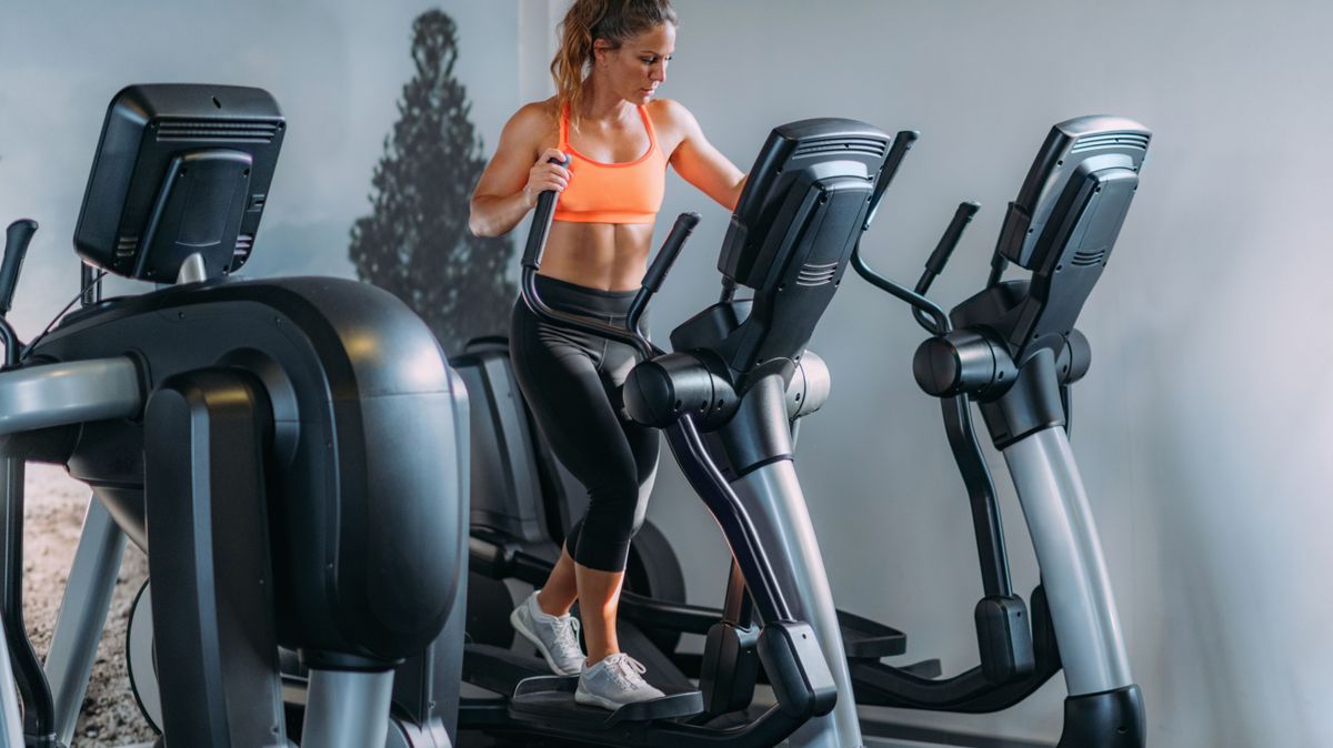 Woman Exercising on Elliptical Cross Trainer