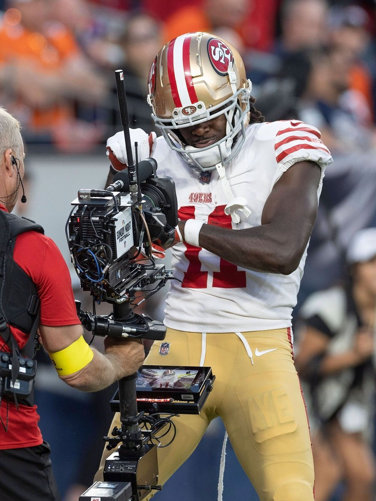 September 25, 2022, Denver, Colorado, USA: 49ers WR BRANDON AIYUK hams it up for the television camera after catching a TD Pass during the 1st. Half at Empower Field at Mile High Sunday evening. Th...
