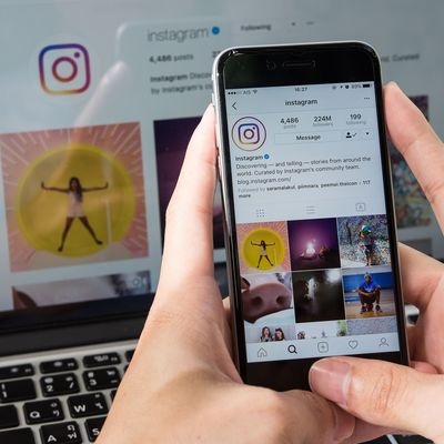 CHIANG MAI, THAILAND - JUNE 24, 2017: A man hand holding iphone with new logo of instagram application. Instagram is largest and most popular photograph social networking.