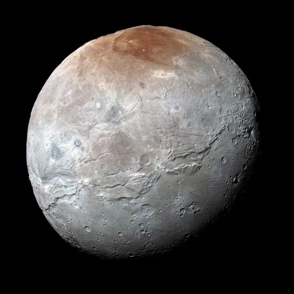 Mit seinem roten Fleck sieht Charon seinem großen Begleiter recht ähnlich.
