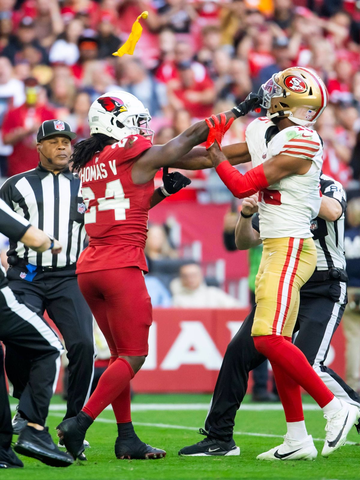 NFL, American Football Herren, USA San Francisco 49ers at Arizona Cardinals Jan 5, 2025; Glendale, Arizona, USA; Referees throw yellow penalty flags as San Francisco 49ers wide receiver Jauan Jenni...