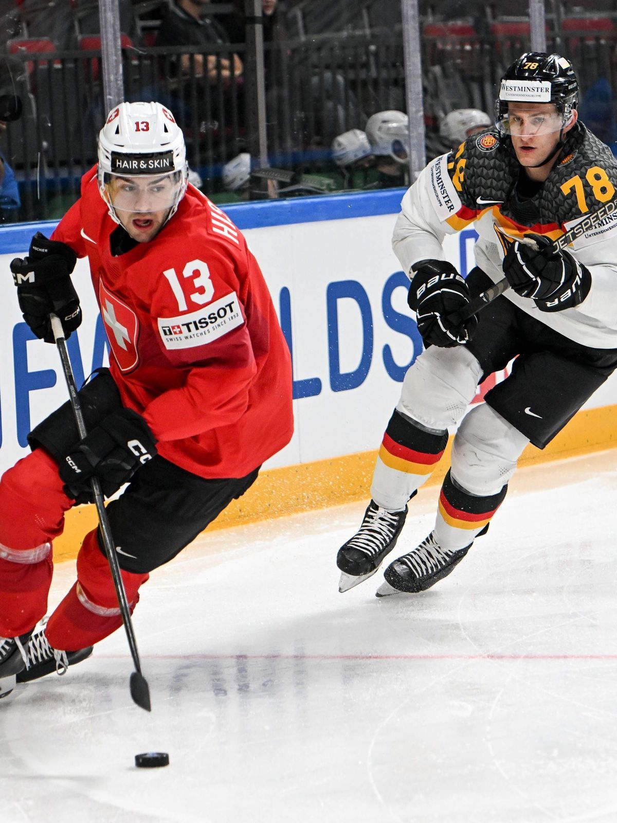RIGA, LATVIA - MAY 25: Nico Hischier of Switzerland defends the puck against Nico Sturm of Germany during the 2023 IIHF Ice hockey, Eishockey World Championship, WM, Weltmeisterschaft Finland - Lat...