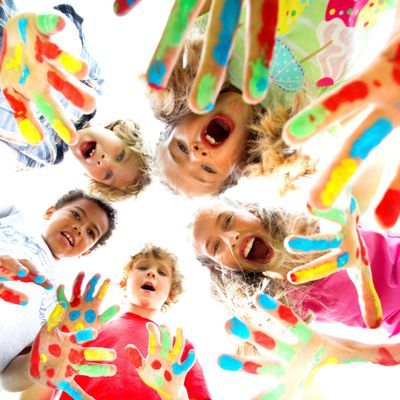 smiling kids with colourfull hands