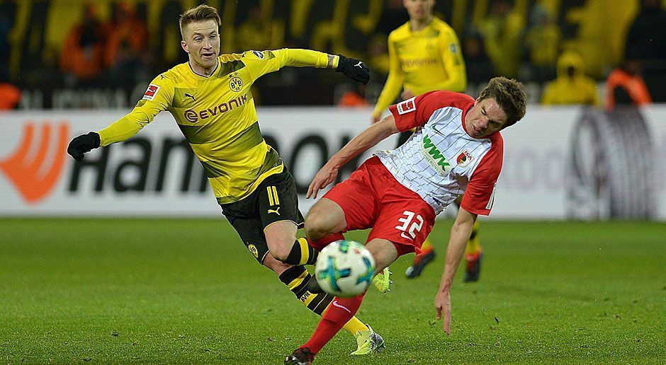 
                <strong>Borussia Dortmund gegen FC Augsburg: Die BVB-Stars in der Einzelkritik</strong><br>
                Nach starkem Beginn kam Borussia Dortmund gegen den FC Augsburg nicht über ein 1:1 hinaus. Während Marco Reus - wie schon in der Europa League - glänzte und sich eine Top-Note abholte, blieb Neuzugang Michy Batshuayi erstaunlich blass. Und gleich mehrere Spieler holten sich eine Vier ab. Die ran.de-Noten für die BVB-Stars im Montagsspiel des 24. Bundesliga-Spieltags.
              