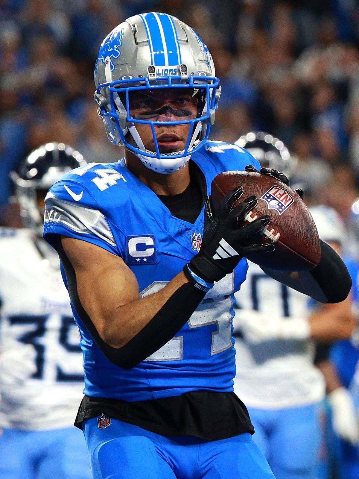 Tennessee Titans vs Detroit Lions DETROIT,MICHIGAN-October 27: Detroit Lions wide receiver Amon-Ra St. Brown (14) scores a touchdown during the first half of an NFL, American Football Herren, USA f...