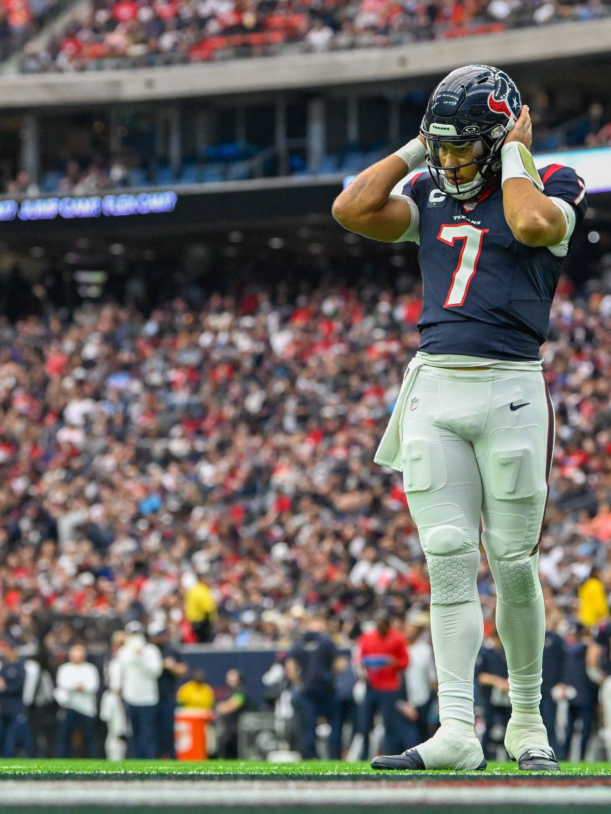 HOUSTON, TX - DECEMBER 31: Houston Texans quarterback C.J. Stroud (7) listens to a play call in his helmet from the sideline during the football game between the Tennessee Titans and Houston Texans...
