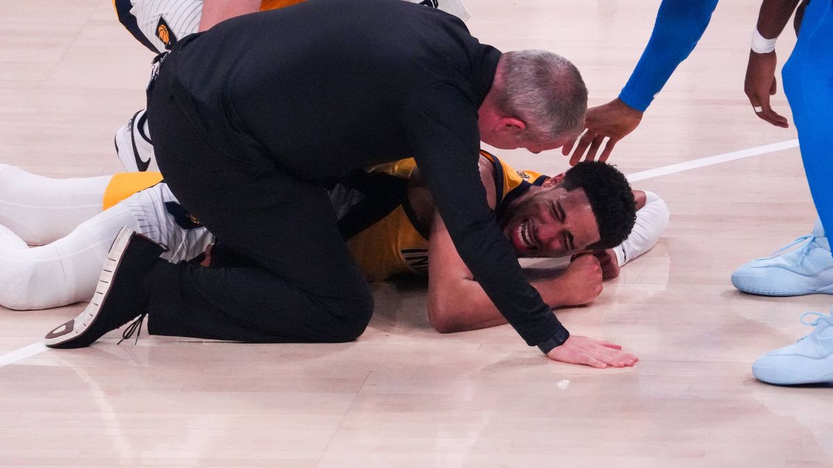 (250623) -- OKLAHOMA CITY , June 23, 2025 -- Tyrese Haliburton (down) of Indiana Pacers reacts after suffering an injury during game seven of the 2024-2025 season NBA, Basketball Herren, USA Finals...
