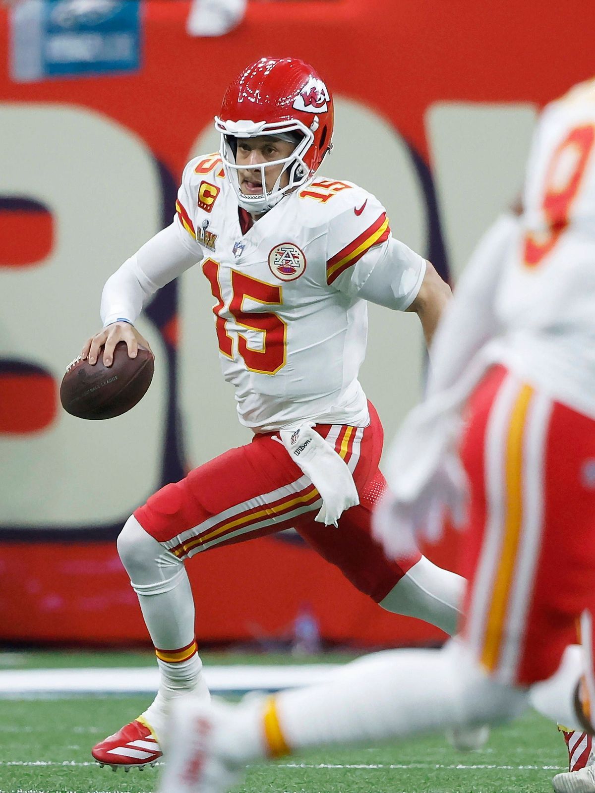 Kansas City Chiefs quarterback Patrick Mahomes scrambles out of the pocket in the third quarter against the Philadelphia Eagles before the Eagles defeat the Kansas City Chiefs 40-22 in Super Bowl L...