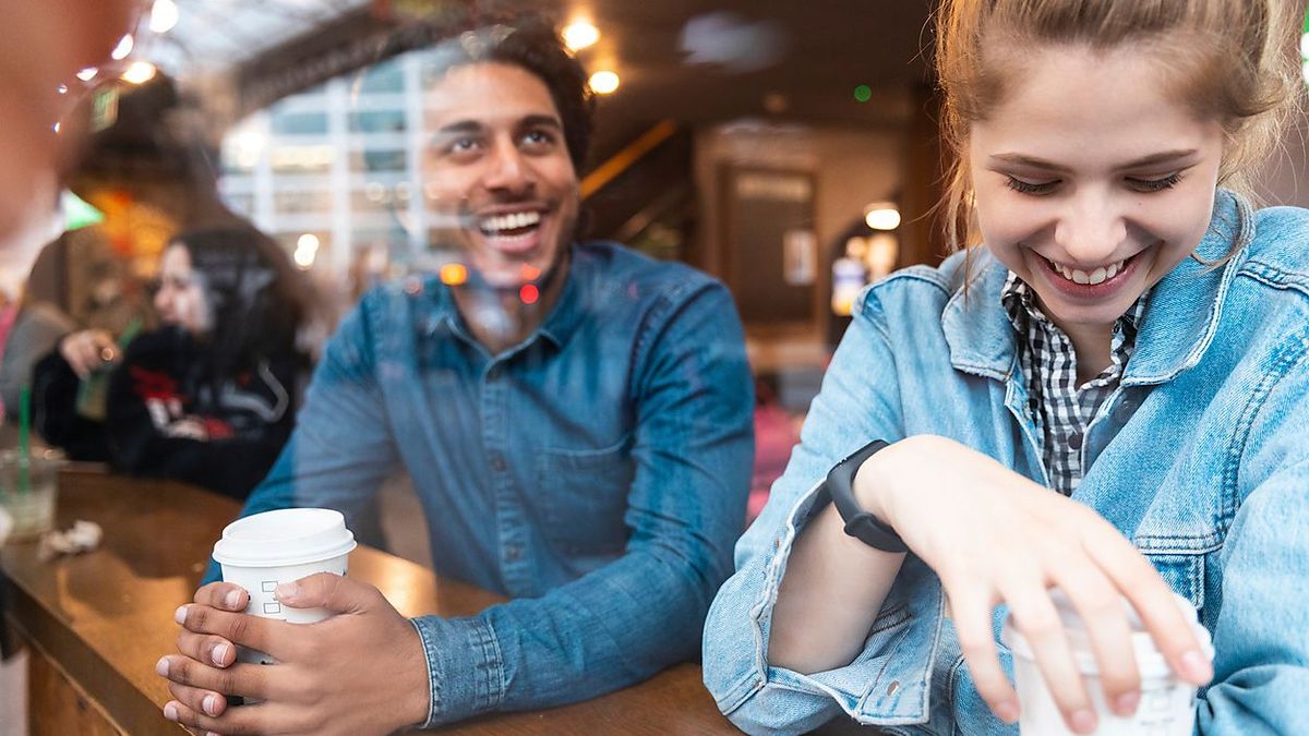 Friends having fun together in a coffee shop