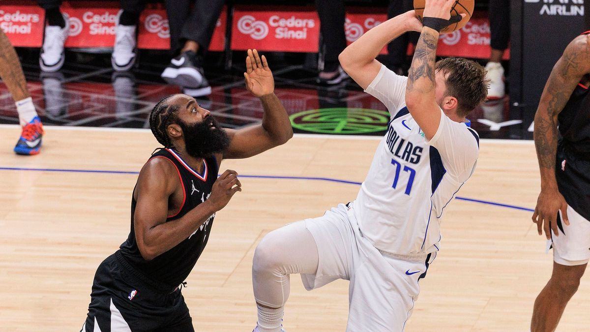 November 25, 2023, Los Angeles, California, USA: James Harden 1 of the Los Angeles Clippers is unable to block Luka Doncic 77 of the Dallas Mavericks as he takes a shot during their NBA, Basketball...