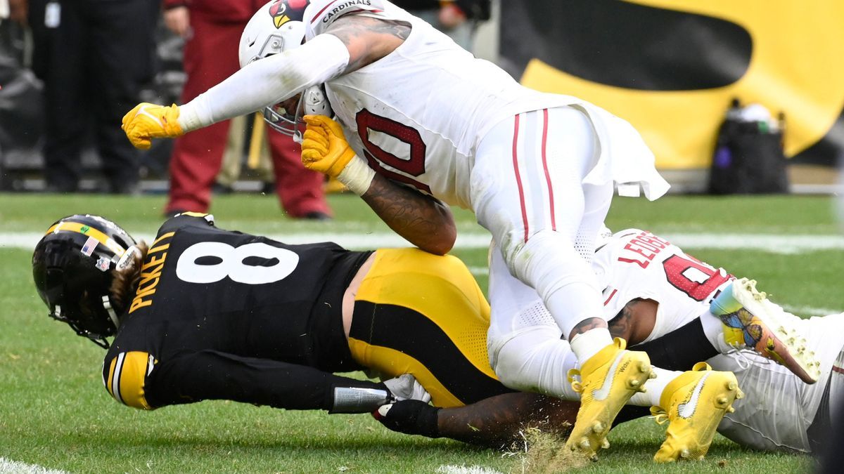 Pittsburgh Steelers quarterback Kenny Pickett (8) scrambles to the one yard line and is injured on the tackle in the second quarter against the Arizona Cardinals at Acrisure Stadium on Sunday , Dec...