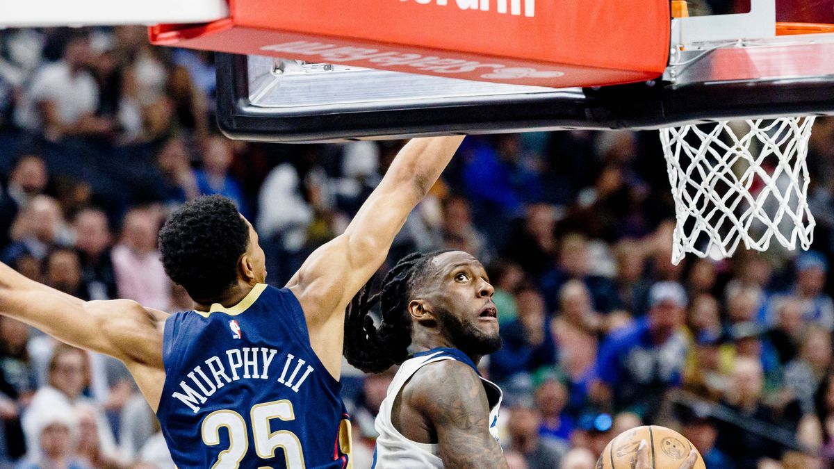 Taurean Prince 12 of the Minnesota Timberwolves shoots over Trey Murphy III 25 of the New Orleans Pelicans during the second half of an NBA, Basketball Herren, USA basketball game between the Minne...