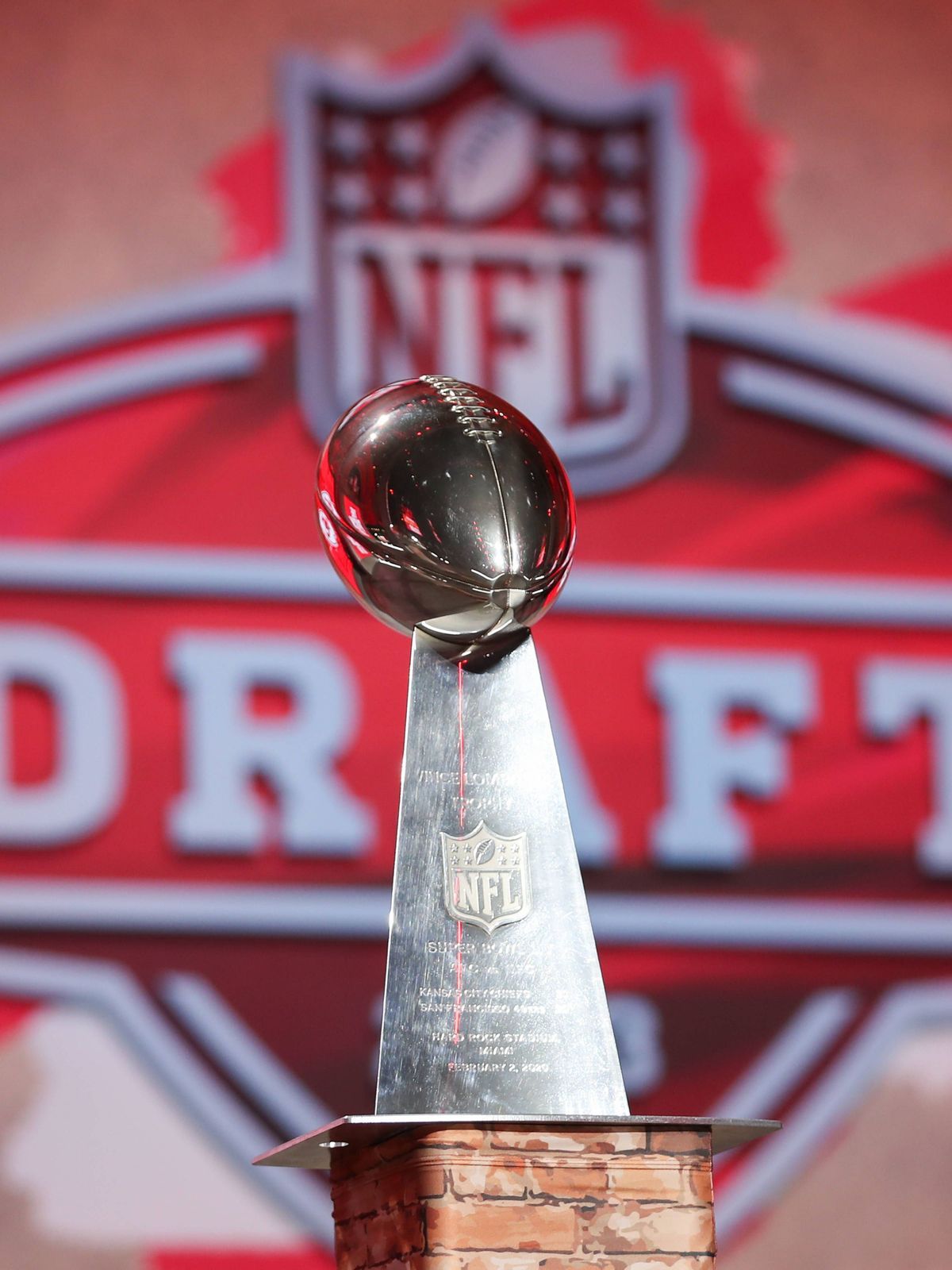 KANSAS CITY, MO - APRIL 27: A view of a Kansas City Chiefs Lombardi Trophy with the NFL, American Football Herren, USA Draft logo in the background during first round of the NFL Draft Red Carpet ev...