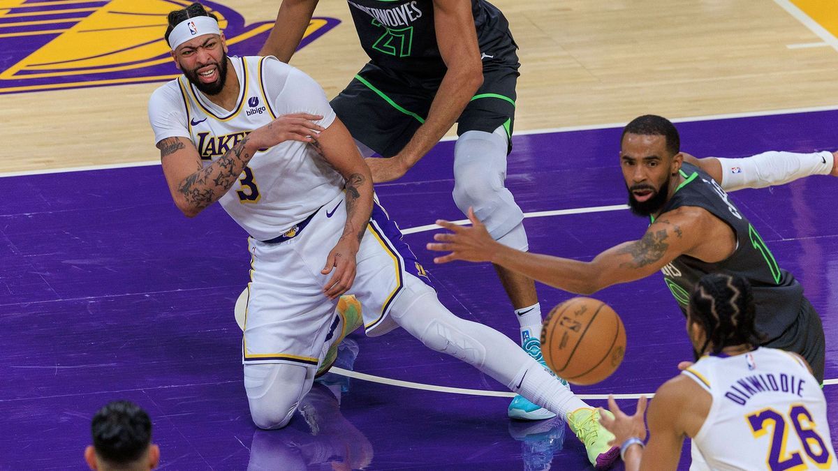 April 7, 2024, Los Angeles, California, USA: Anthony Davis 3 of the Los Angeles Lakers beats Rudy Gobert 27 of the Minnesota Timberwolves for an offensive rebound during their NBA, Basketball Herre...
