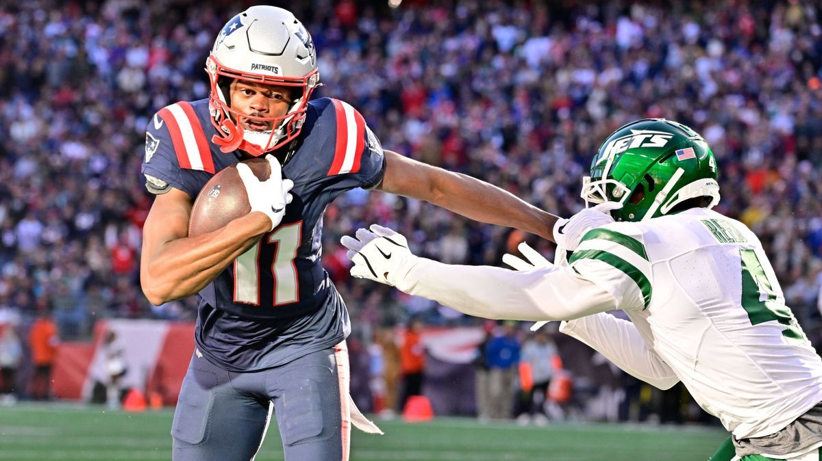 October 27, 2024: New England Patriots wide receiver Tyquan Thornton (11) stiff arms New York Jets cornerback D.J. Reed (4) during the second half at Gillette Stadium, in Foxborough, Massachusetts....