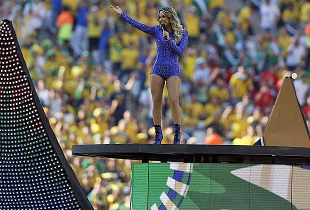 
                <strong>Der LED-Ball öffnet sich</strong><br>
                Und raus kommt brasilianische Sängerin Claudia Leitte. Sie ist ein absoluter Superstar im Gastgeberland und wird frenetisch gefeiert.
              
