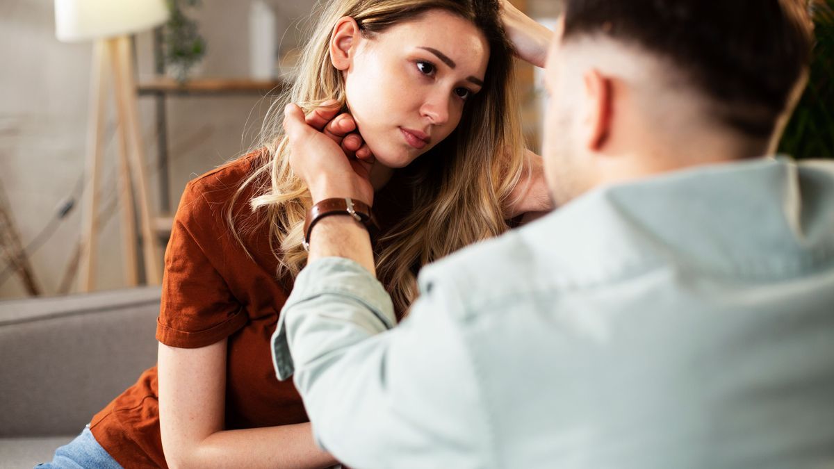 Young woman having a problem. Boyfriend comforting his sad girlfriend.